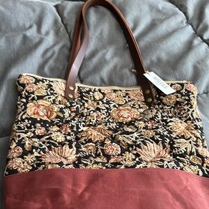Elegant Black and Brown Shoulder Bag with Floral Design